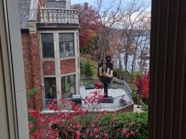 Man Bought a House Next to His Ex-wife Just to Install a Giant Middle Finger 2 businessinsider